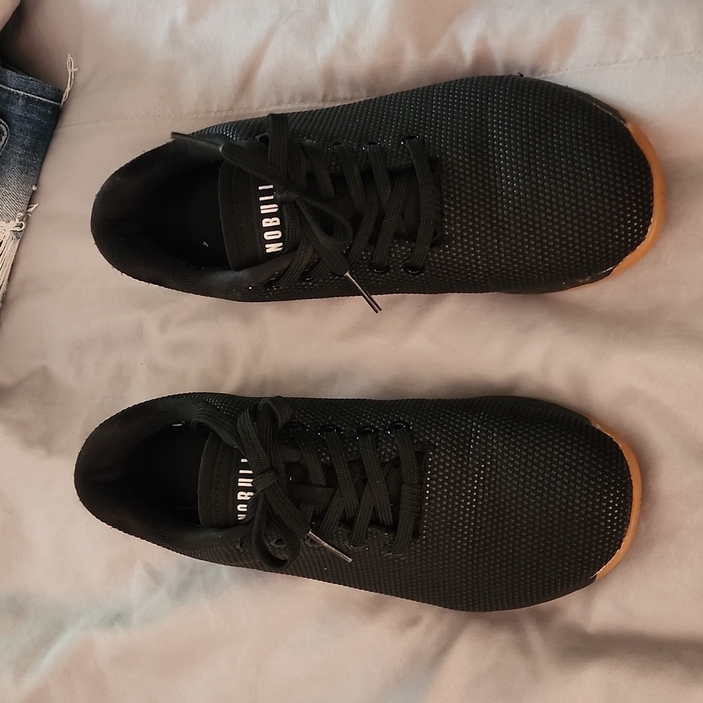 Genty used size 9 gum bottom Nobull trainers.